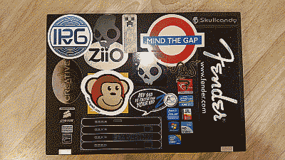 Screenshot showing a Lenovo laptop with numerous stickers